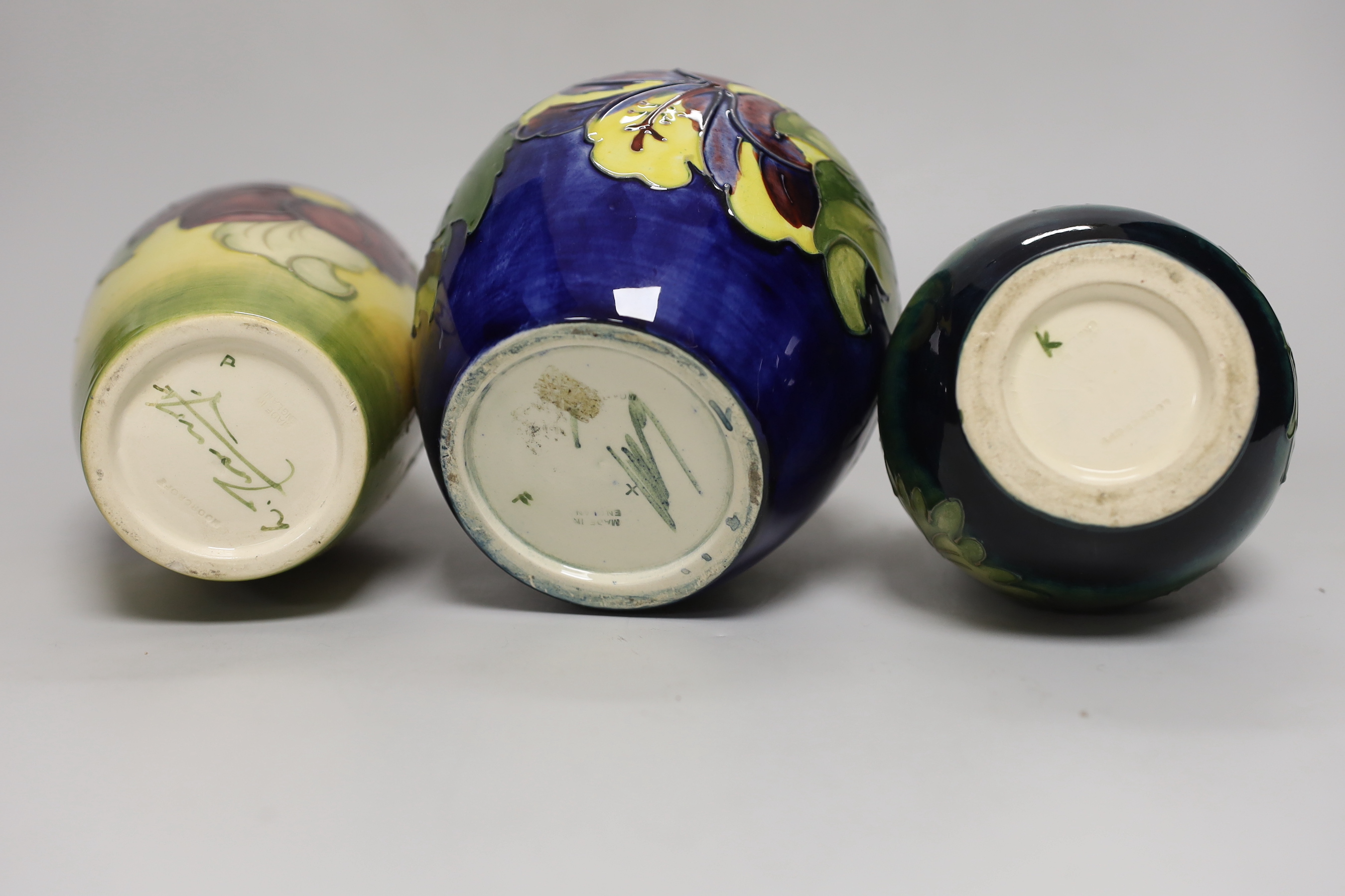 A Moorcroft hibiscus jar and cover, 16cm, an anemone vase and another